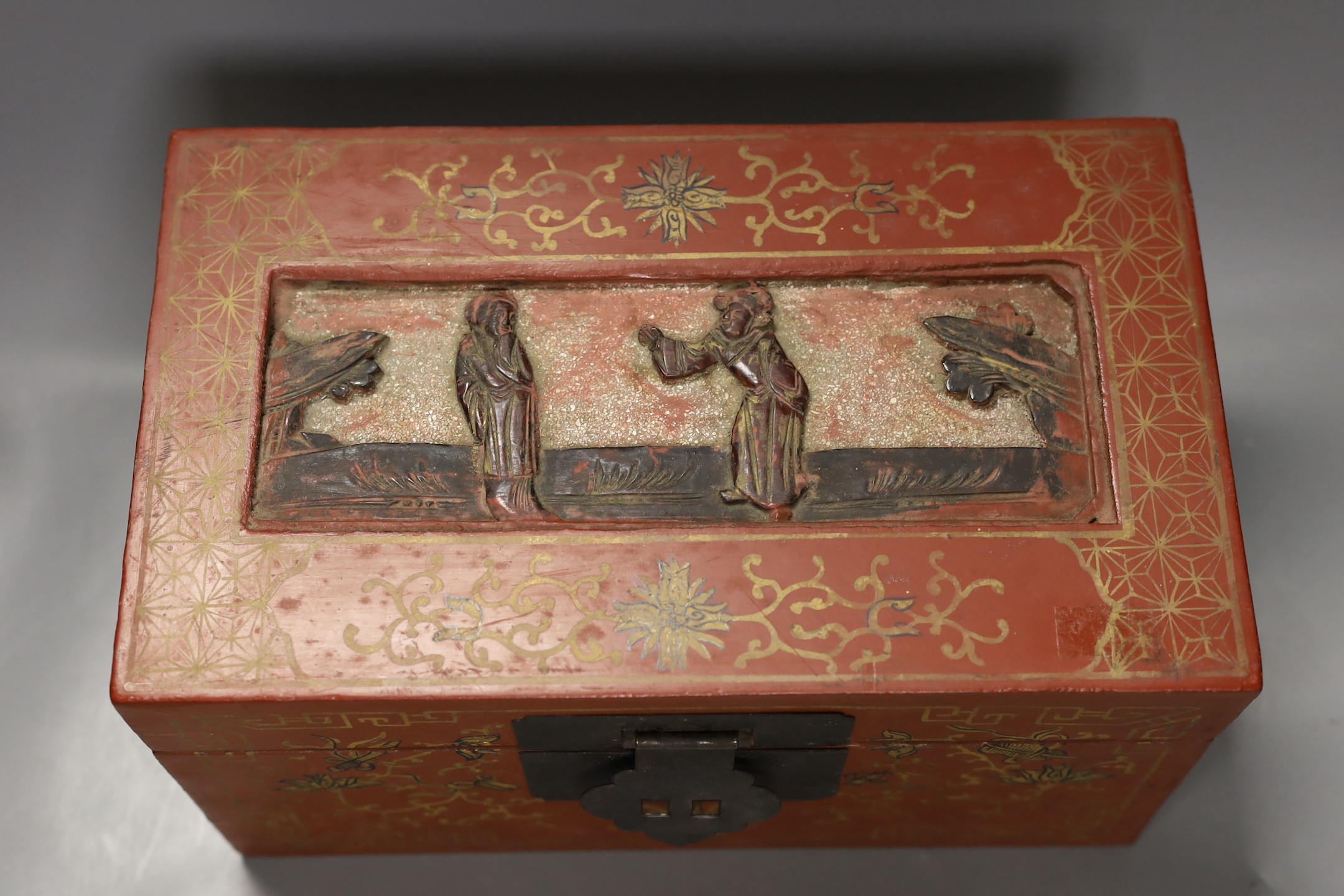 A Chinese lacquered wood Budai carving, 34cm wide, and a Chinese lacquered wood box (2)